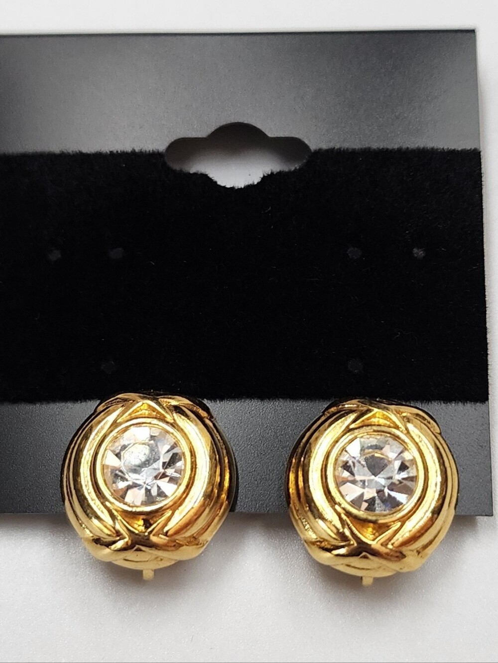 Nolan Miller Gold tone clip-on earrings’ with Clear Crystals